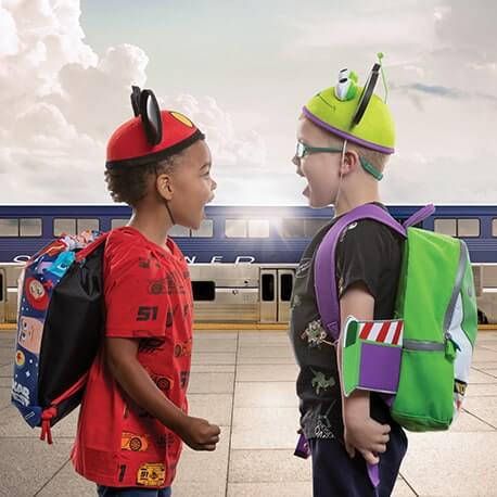 two children wearing pixar hats
