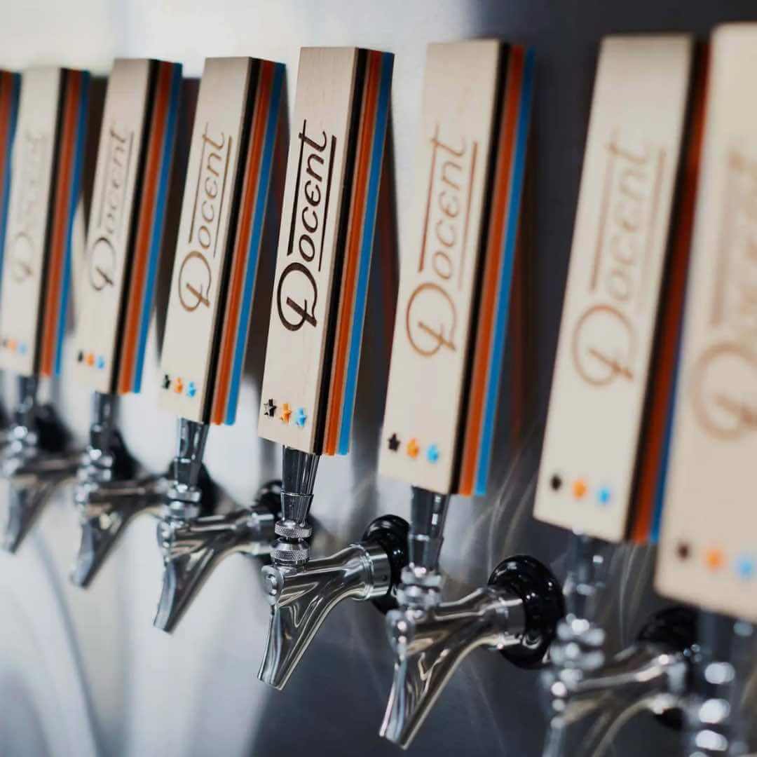 Beer taps lined up at Docent Brewing in San Clemente, California.