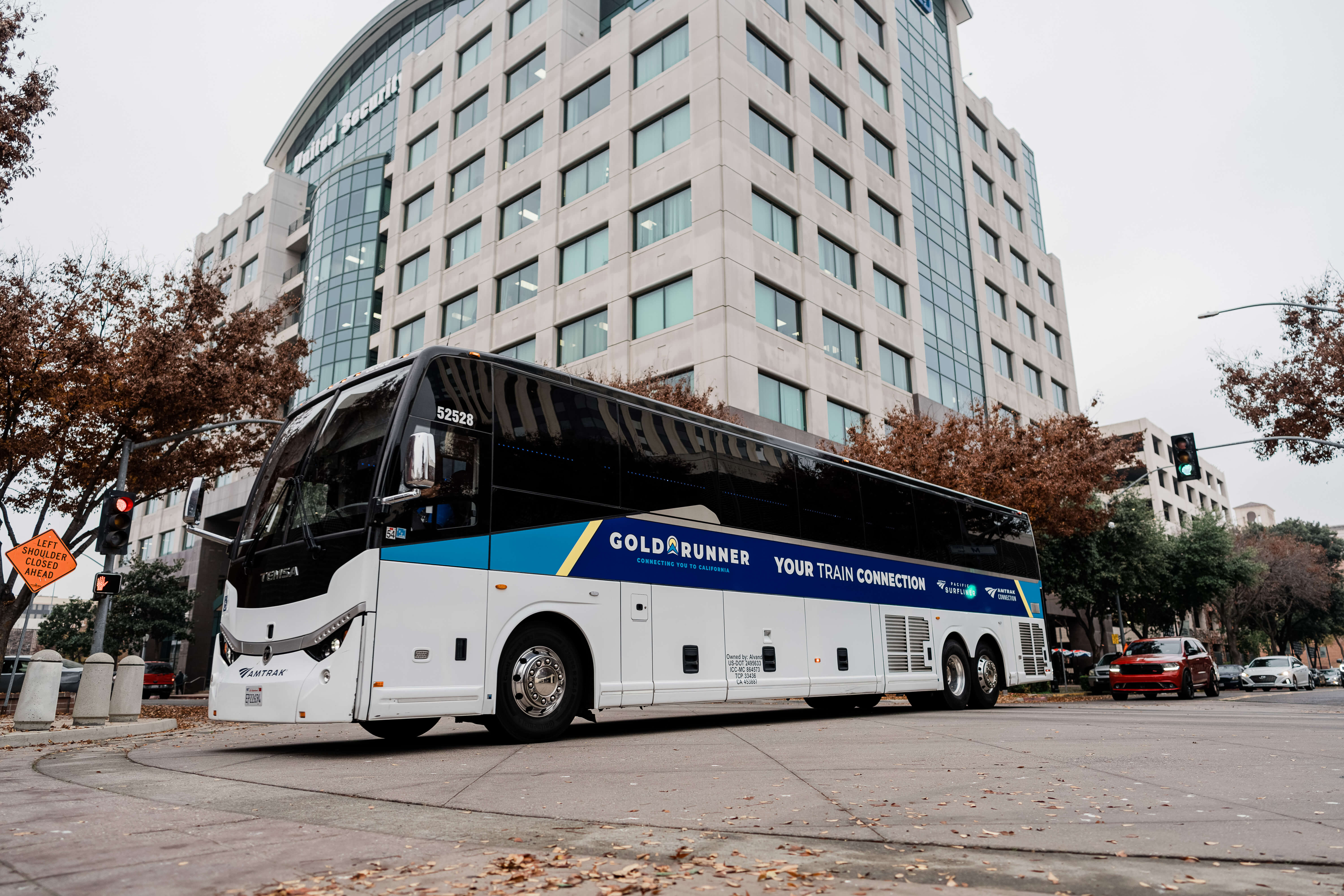 Bus with the inscription &ldquo;Gold Runner&rdquo; in the parking lot 