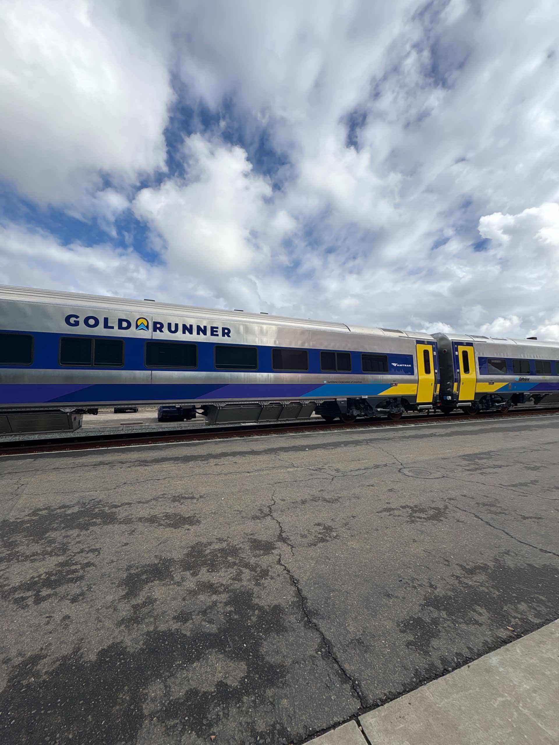 Train cars with the inscription “Gold Runner”