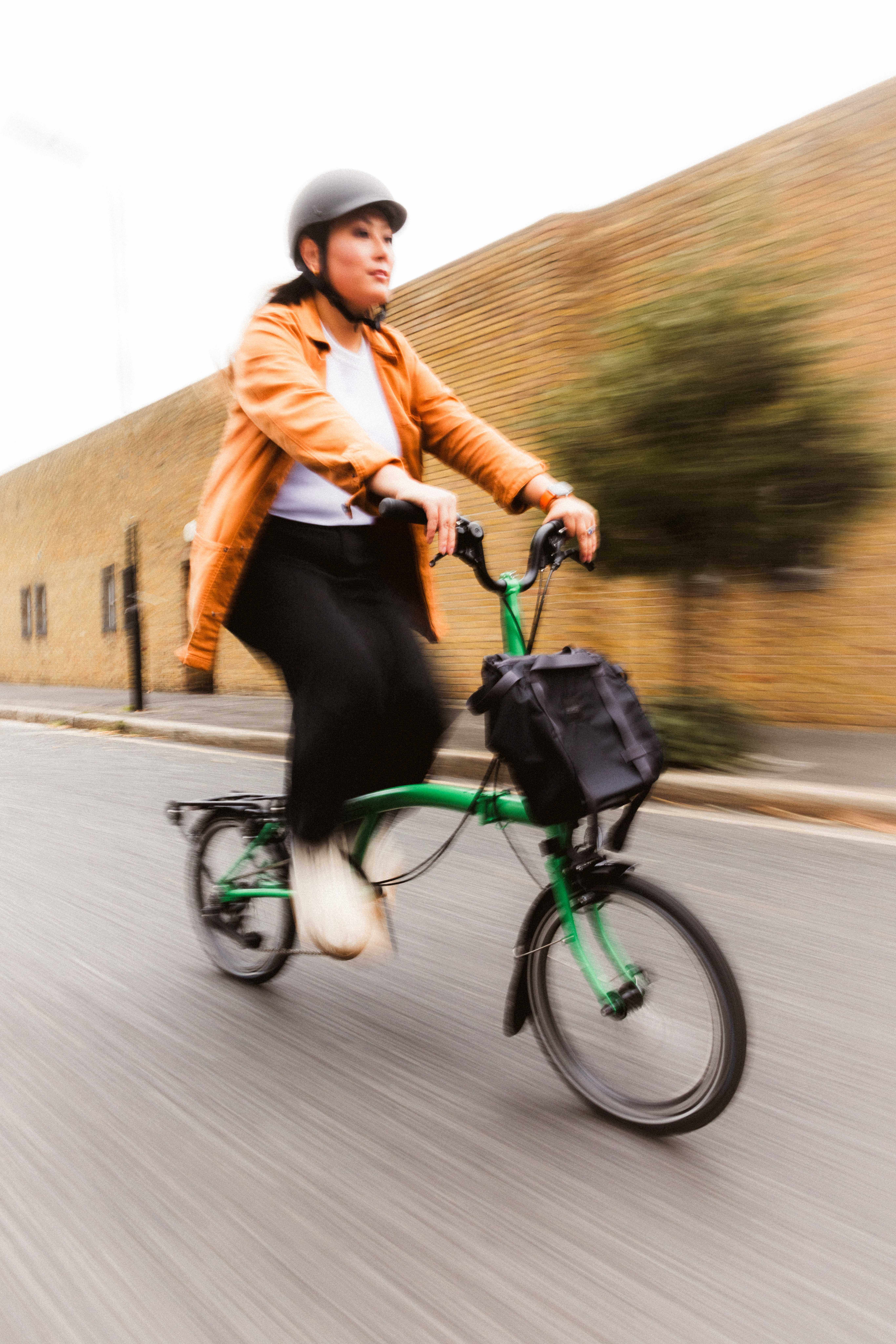 woman riding folding bike